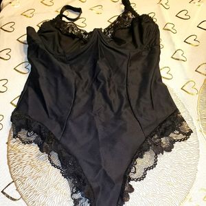 Xl Black sculpting bodysuit. Never worn